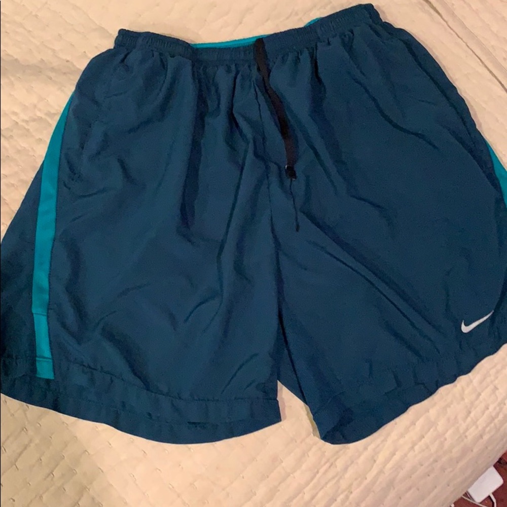 Teal blue nike running shorts
